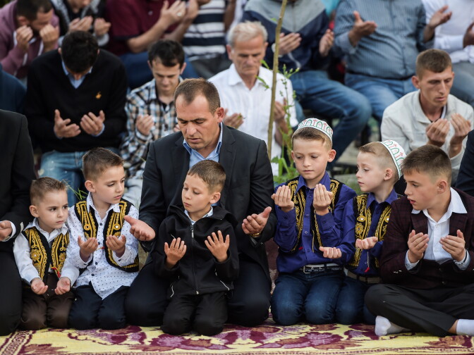 Young Kosovo Muslims attend the Eid al-Fitr prayer near the Sulltan Mehmet Fatih mosque in Pristina on June 25, 2017. 
Eid al-Fitr festival marks the end of the holy Muslim fasting month of Ramadan during which devotees are required to abstain from food, drink and sex from dawn to dusk.   / AFP PHOTO / Armend NIMANI        (Photo credit should read ARMEND NIMANI/AFP/Getty Images)