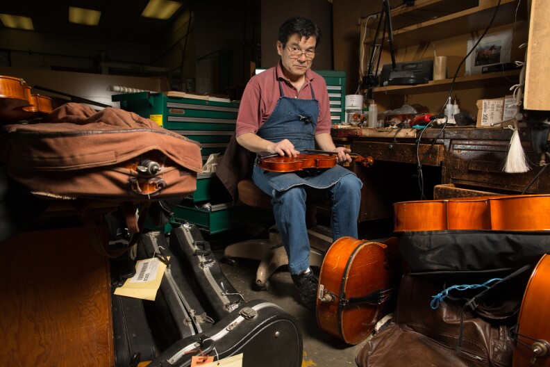 Edwin Barker is one of two string instrument repair technicians remaining at Los Angeles Unified School District's Music Repair Shop.