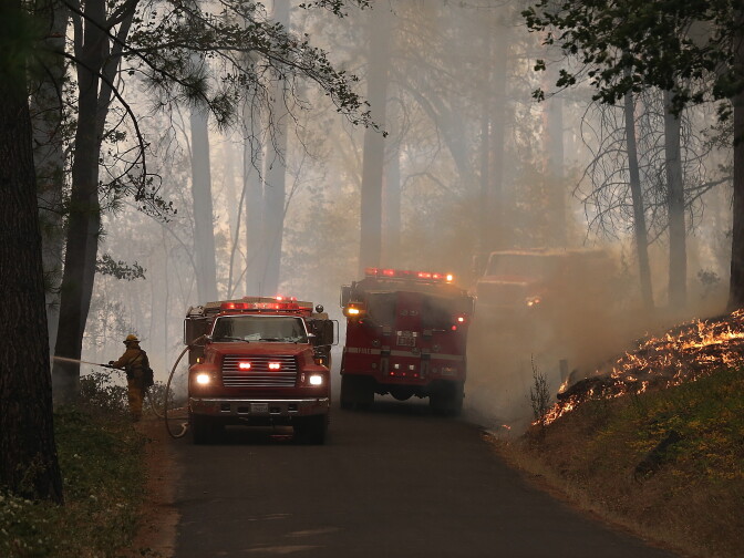 GROVELAND, CA - AUGUST 21:  Firefighters monitor a back fire while battling the Rim Fire on August 21, 2013 in Groveland, California. The Rim Fire continues to burn out of control and threatens 2,500 homes outside of Yosemite National Park. Over 400 firefighters are battling the blaze that is only 5 percent contained.  (Photo by Justin Sullivan/Getty Images)