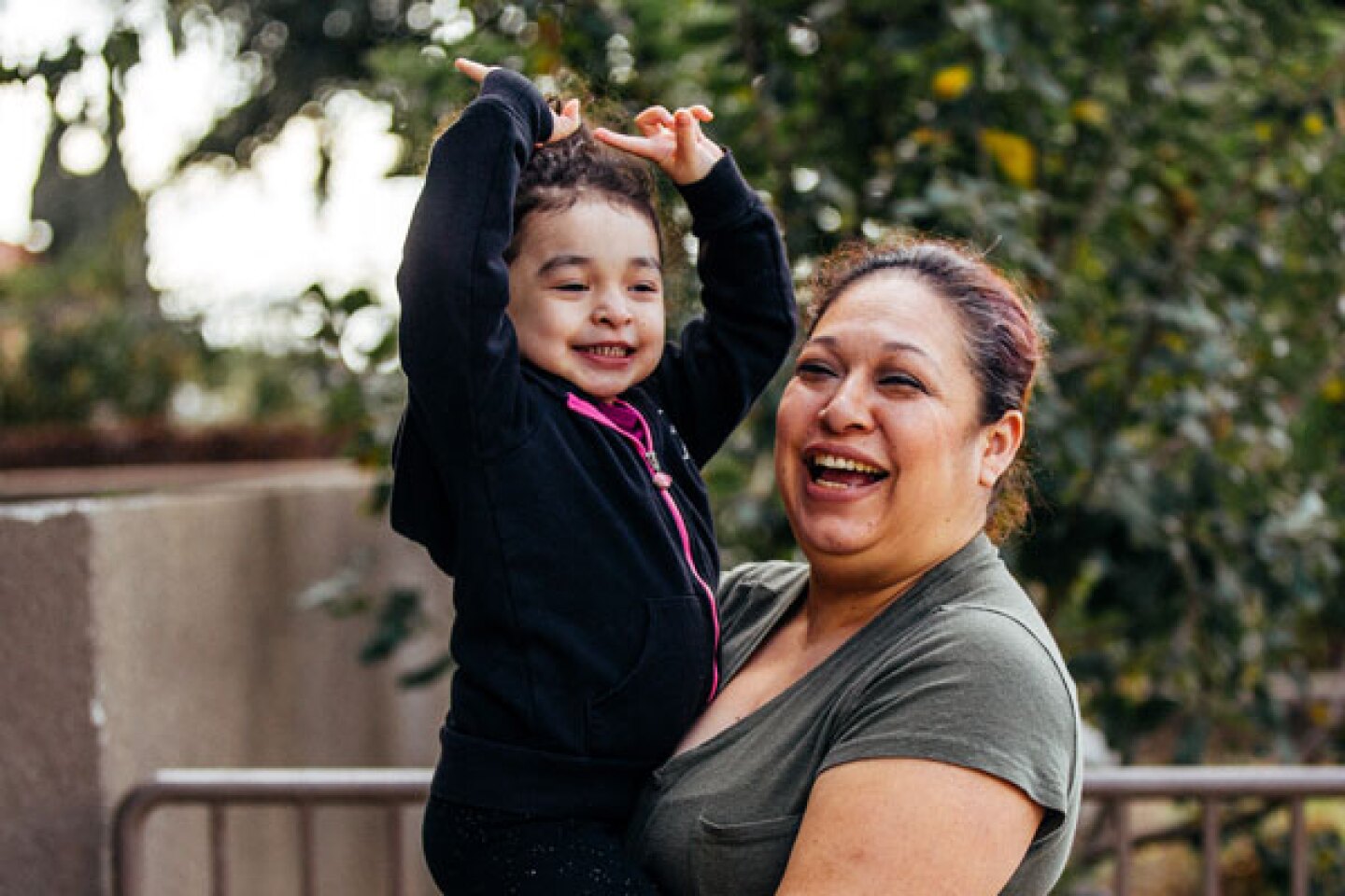 Aurora Reyes smiles with her daughter for a photo.