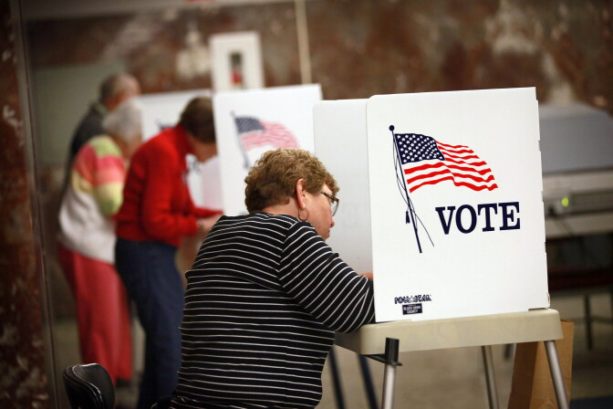 WATERLOO, IA - SEPTEMBER 27:  Residents fill in their ballots during early voting at the Black Hawk County Courthouse on September 27, 2012 in Waterloo, Iowa. Early voting starts today in Iowa where in the 2008 election 36 percent of voters cast an early ballot.  (Photo by Scott Olson/Getty Images)