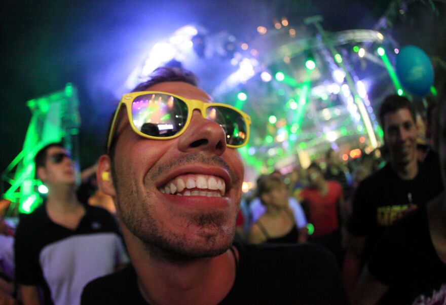 Ravers dance at the "Nature One" electronic music festival in the former US missile base Pydna near Kastellaun, western Germany, on August 6, 2011. The festival is expecting around 55,000 visitor and is one of the largest open air festival for electronic music in Europe. 