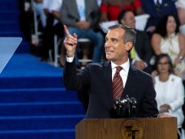 Mayor Eric Garcetti takes to the podium at his inauguration at City Hall in Los Angeles, California on July 1, 2017.