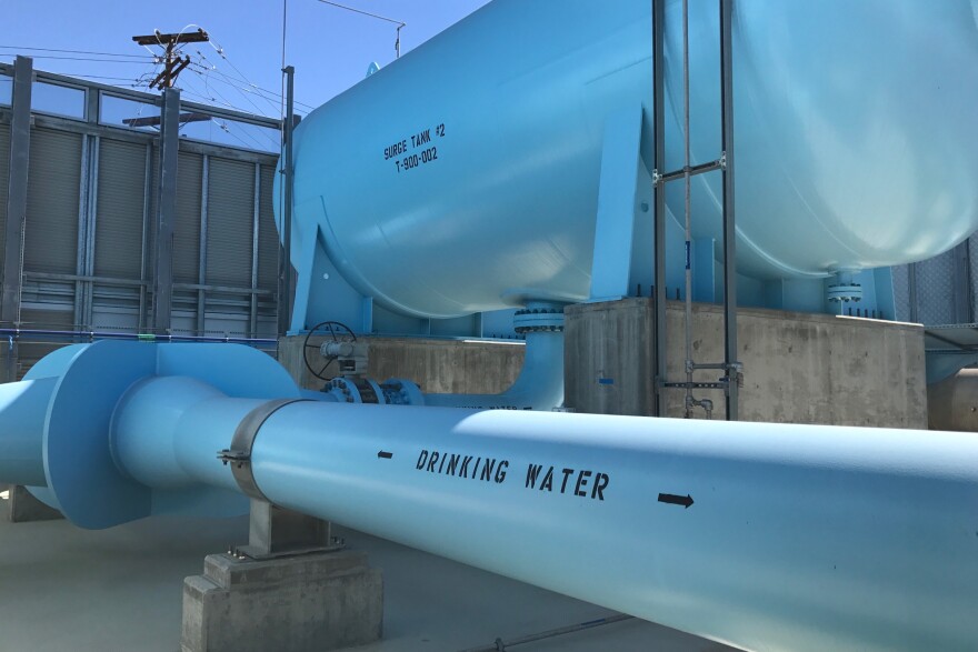 A pipe sends drinking water from the Carlsbad desalination plant to taps in San Diego County, Oct. 16, 2017. Poseidon Water, which owns the plant, wants to build a similar one in Huntington Beach.  