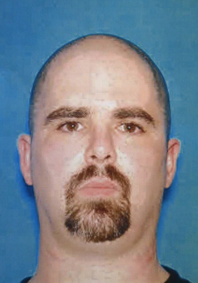 UNSPECIFIED LOCATION - AUGUST 6:  A copy photograph of the mug shot handed out by the FBI of the suspect Wade Michael Page after a press conference on the shooting at the Sikh Temple of Wisconsin where yesterday a gunman fired upon people at service August, 6, 2012 in Oak Creek, Wisconsin. At least six people were killed when the shooter identified as Wade Michael Page opened fire on congregants in the Milwaukee suburb. The suspect who was a United States Army veteran was killed in a shootout with police.  (Photo by FBI via Getty Images)