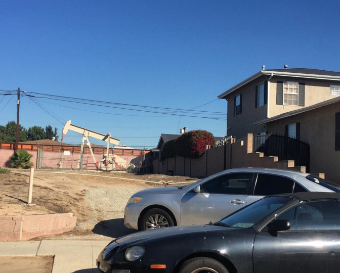 An oil well next to a home in the Wilmington neighborhood of Los Angeles, California. 