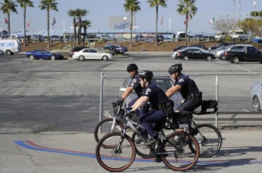 Los Angeles Police Department officers patrol the parking lot outside Dodger Stadium prior to the Dodgers' game against the St. Louis Cardinals on April 14, 2011, in Los Angeles. Bryan Stow, the father of two, was beaten in a parking lot outside Dodger Stadium after the teams' March 31 season opener and remains hospitalized in Los Angeles in a medically induced coma.