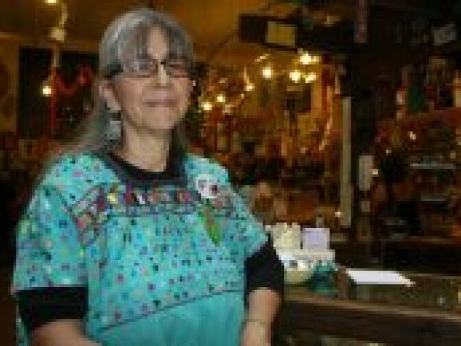 Nancy Madrid-Ally, co-owner of Olvera Street Candle Shop, that is facing a rent increase of almost 400 percent, wears a badge saying "Save Olvera Street," on April 24, 2010, at Olvera Street in downtown Los Angeles.