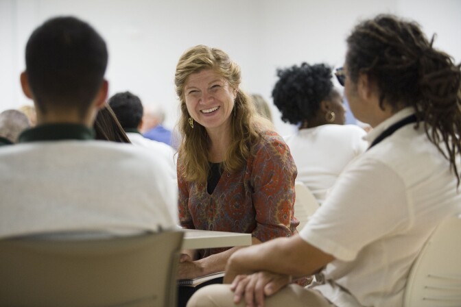 Arts for Incarcerated Youth Network executive director Kaile Shilling speaks with one of the youth at Campus Kilpatrick during the Create Justice forum. 