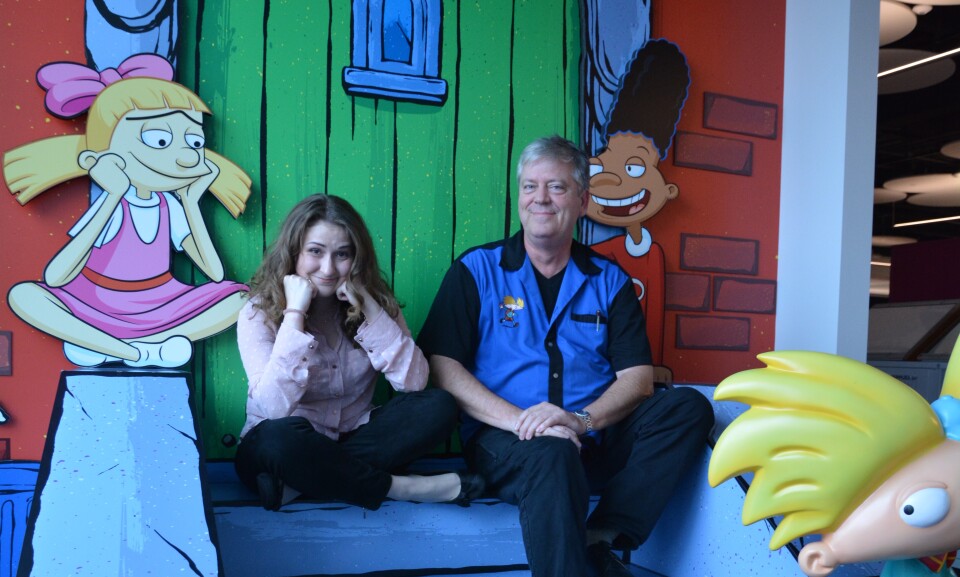 Francesca Marie Smith and Craig Barlett sitting on the stoop at Nickelodeon, Burbank