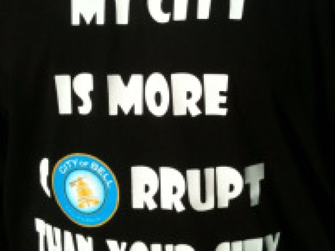 One Bell resident expressed his outrage over exorbitant pay for city officials on his T-shirt at a recent community meeting.