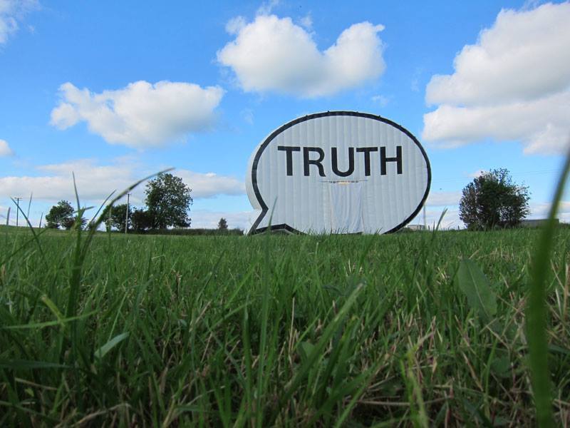 "The Truth Booth" is an inflatable booth created by an art collective called Cause Collective. 