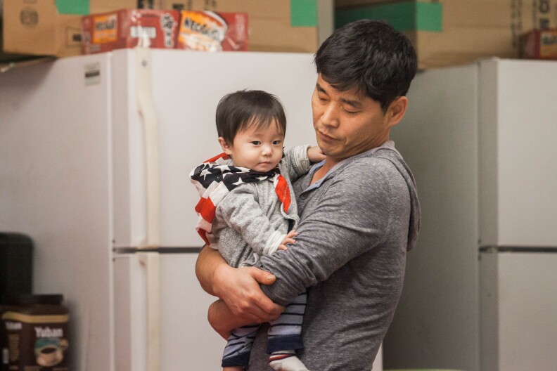 North Korea refugee Sammy Hyun plays with his son after a church service in Los Angeles, Calif. on Sunday February 4, 2018.