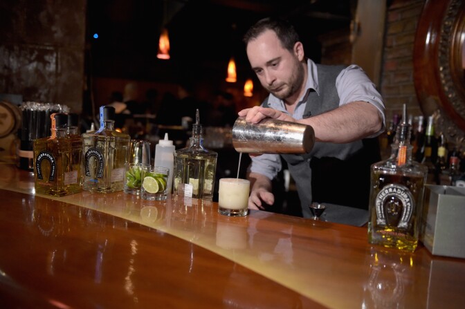 NEW YORK, NY - FEBRUARY 21:  Mixologist Jimmy Fransioli prepares a Herradura cocktail at Tequila Herradura premieres 'Luck Is Earned' on National Margarita Day eve featuring a live performance and discussion with Grammy winner Eric Krasno on February 21, 2017 in New York City.  (Photo by Jason Kempin/Getty Images for Tequila Herradura)
