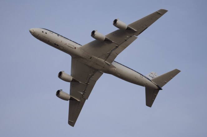 The under belly of a plan is visible while airborne.