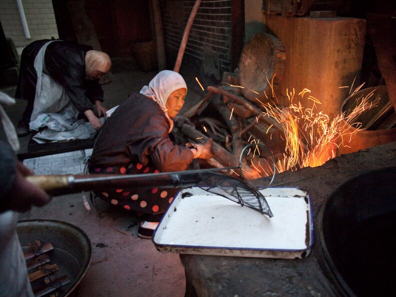 Women at the Wangjia mosque work early in the morning in the kitchen. The mosques began as Quranic schools for girls in the late 17th century. They were the only places girls could receive an education; now, they also serve as community centers.