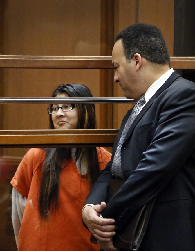Alejandra Guerrero, left, appears in Los Angeles Superior Court Monday, Jan. 12, 2015 with her attorney Errol Cook, right, as one of four defendants being charged in connection to the 2014 beating death of USC graduate student Xinran Ji student during an attempted robbery. (AP Photo/Los Angeles Times, Al Seib, Pool)