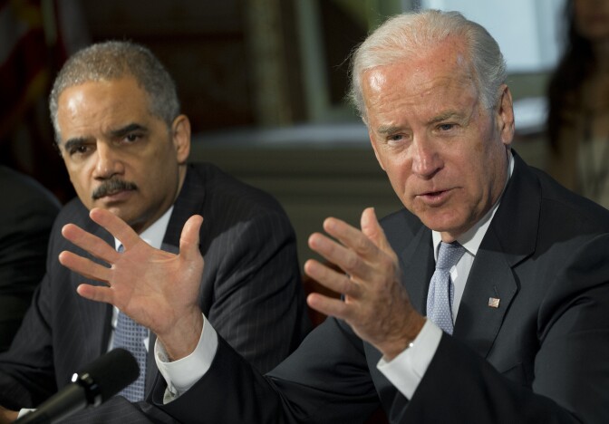 US Vice President Joe Biden speaks alongside Attorney General Eric Holder (L) as he meets with representatives of victims’ groups and gun safety organizations at the Eisenhower Executive Office Building adjacent to the White House in Washington, DC, on January 9, 2013. The meeting comes as US President Barack Obama's administration works to develop gun policy proposals following last month's mass shooting in Newtown, Connecticut.