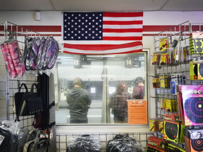 An American flag hung over a window looking into the firing range at On Target shooting range in Laguna Niguel on Saturday, April 12 2014. 