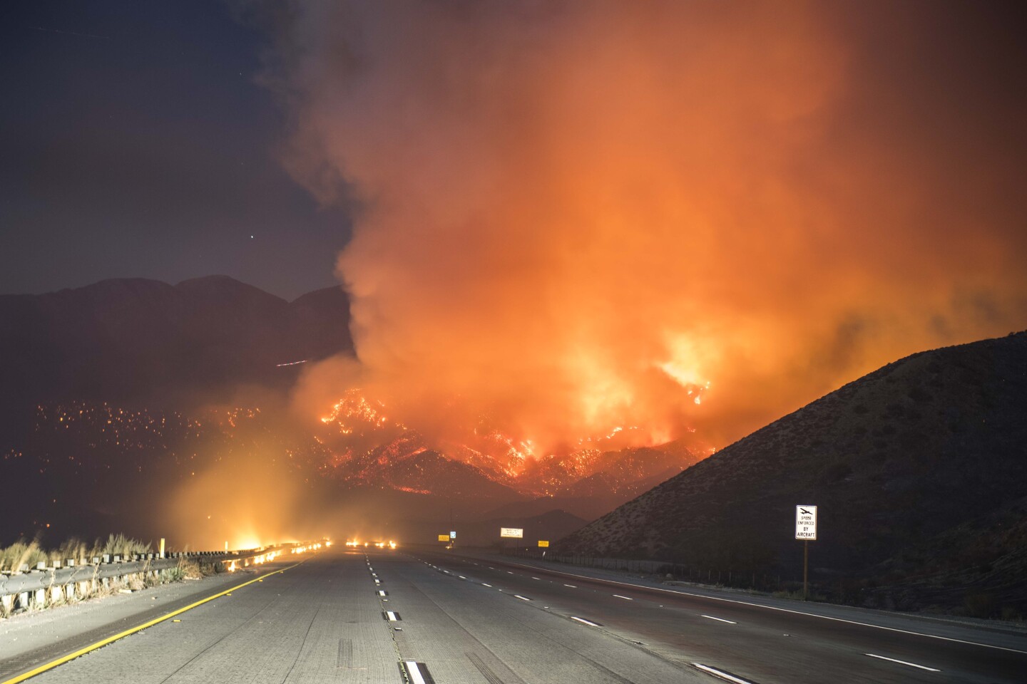 The Blue Cut Fire off Interstate 15 in the Cajon Pass Tuesday evening. 



The Blue Cut Fire burns in San Bernardino County Tuesday evening August 16th, 2016. The fire had burned 15,000 acres and was 0% contained, with multiple structures threatened and destroyed. Interstate 15 was also shut down at the 215. 