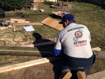 Bulmaro Roderte, a crew leader with the company Seismic Safety, measures wood used to retrofit a home in Eagle Rock. Seismic Safety is one of the companies approved by the California Earthquake Authority to participate in a pilot program to encourage homeowners to retrofit.