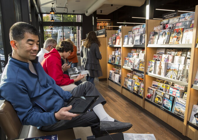 Jeff Ing of Seattle uses a Kindle Fire tablet device at the newly opened Amazon Books store on November 4, 2015 in Seattle, Washington.