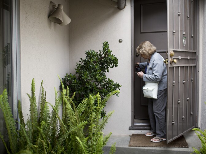 Shirley Ross leaves to go to the grocery store with her new roommate, Louis Rubin, on Monday afternoon, July 6, 2015. When Ross bought this house in 1962, it was $32,000. “Now I have agents at the door that want to sell it," Ross said. "And the last estimate I got was $1.4 million. Can you imagine?”