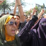 Moroccan women shout slogans during a demonstration against a film deemed offensive to Islam, on September 12, 2012 near the US consulate in Casablanca. A film at the center of anti-US protests in the Middle East which killed a diplomat was made by an Israeli-American who describes Islam as a 'cancer,' the Wall Street Journal reported. The movie, 'Innocence of Muslims,' was directed and produced by Sam Bacile, a 52-year-old real-estate developer from southern California who says Islam is a hateful religion.