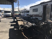 The company tows in two to three charred RV's each month, like this one from the San Fernando Valley.