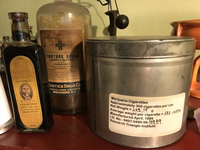 Lonnie Painter collects antique opioid- and cannabis-based tinctures. The large tin is from an experimental federal program that provides marijuana pre-rolls to selected patients around the country.  