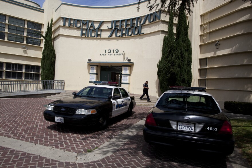 Los Angeles Police cruisers are parked out side of Jefferson High School to keep an eye on a student protest against a district-wide scheduling system that has kept them out of the classes they need to graduate.