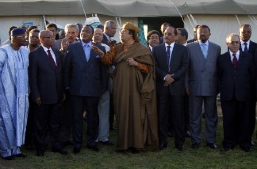 (L-R) Presidents Amadou Toumani Toure of Mali, Jacob Zuma of South Africa, Denis Sassou Nguesso of Congo, Libyan leader Moamer Kadhafi, Mohamed Ould Abdel Aziz of Mauritania and African Union president Jean Ping stand outside a tent erected at Kadhafi's Bab al-Aziziya residence in Tripoli on April 10, 2011.