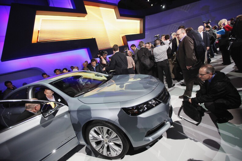 Media members and enthusiasts inspect the newly unveiled 2014 Chevrolet Impala at the New York International Auto Show at the Jacob Javits Convention Center on April 4, 2012 in New York City. The New York International Auto Show features nearly 1,000 brand new vehicles from all auto industry sectors and is open to the public April 6-15.   