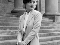 In this Aug. 18, 1933, file photo, Carole Lombard, well known screen actress shown on the courthouse steps at Carson City, Nev., following her divorce from her husband, William Powell. 