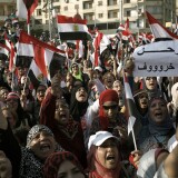 CAIRO, EGYPT - JULY 03: Egyptian opposition protesters celebrate as news is announced of Egyptian President Mohammed Morsi proposing a consensus government as a way out of the country's political crisis, at Egypt's Presidential Palace on July 3, 2013 in Cairo, Egypt. As the Egyptian Army's deadline passed on Wednesday afternoon, President Morsi proposed a consensus government as a way out of the country's political deadlock between the military and Muslim Brotherhood. As unrest spreads throughout the country, at least 23 people were killed in Cairo on Tuesday and over 200 others were injured. It has been reported that the military has taken over state television. (Photo by Ed Giles/Getty Images)