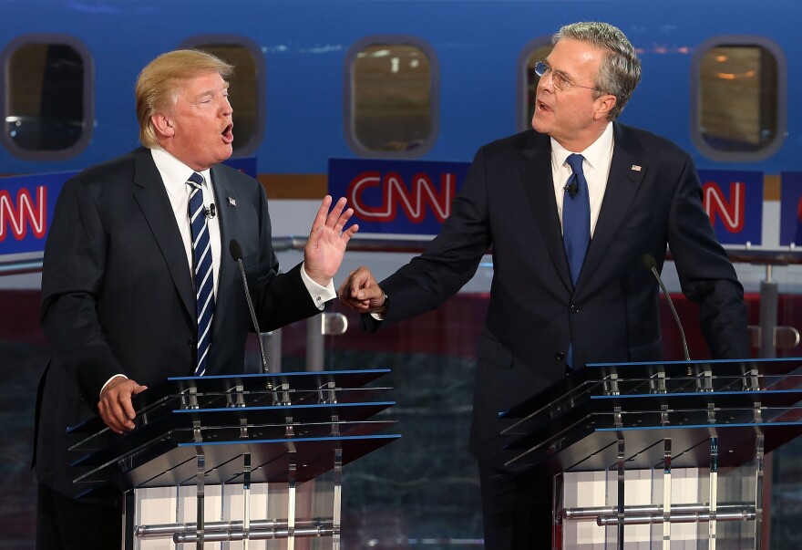 SIMI VALLEY, CA - SEPTEMBER 16:  Republican presidential candidates Donald Trump (L) and Jeb Bush argue during the presidential debates at the Reagan Library on September 16, 2015 in Simi Valley, California. Fifteen Republican presidential candidates are participating in the second set of Republican presidential debates.  (Photo by Justin Sullivan/Getty Images)