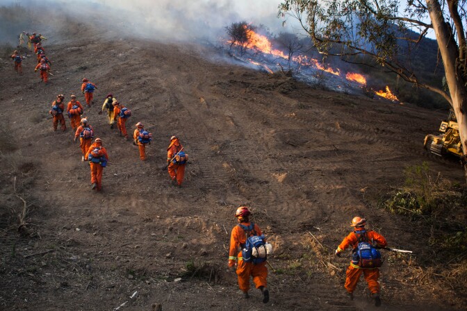 Smokejumpers make their way toward a fire west of Thousand Oaks on May 2, 2013.