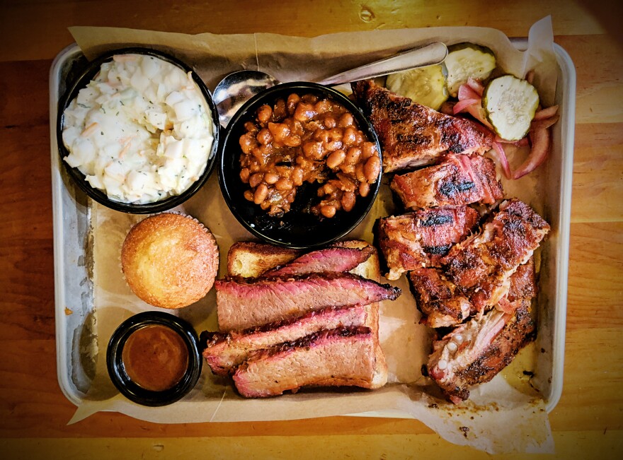 An array of barbecued meats and sides.