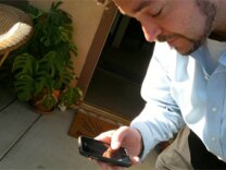 L.A. Unified teacher Daniel Barnhart gets cell phone updates for his trip Thursday to Phoenix to protest SB1070. He's part of a labor union group of several hundred people planning to go for the day.
