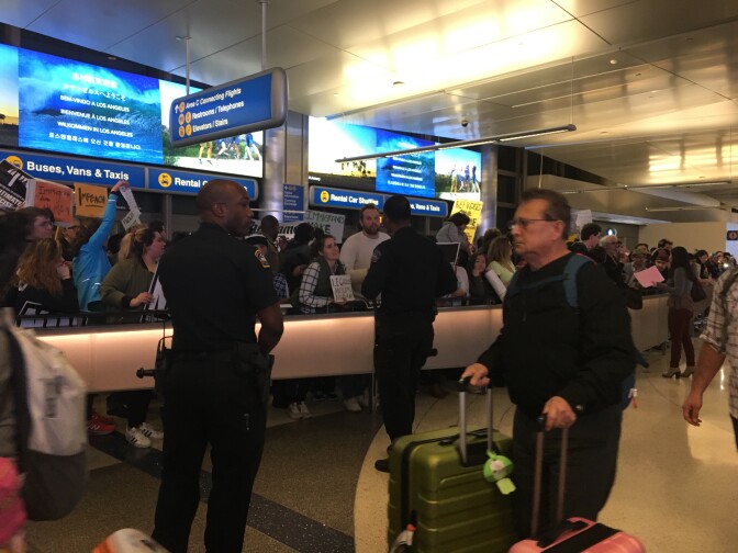 Police arrive to calm protesters at the LAX international terminal Saturday night, Jan. 28, 2017. Chanting "We won't go 'til you let them go," the demonstrators were protesting President Donald Trump's executive order temporarily banning entry to the country from seven Muslin-majority countries. Some travelers were detained as a result.