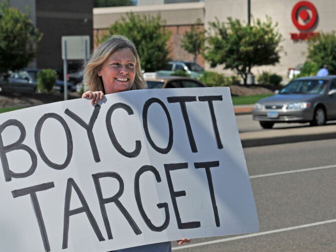 Laura Hedlund, 48, protests in front of a Minnesota Target store after the company made a donation that was used for an ad supporting Republican Tom Emmer's bid to be governor of Minnesota.