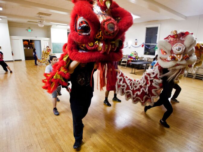 Immortals Awaken Lion Club members Alex Dea, 16, left, and Amie Truong, 15, practice lion dancing at Ynez Elementary School in Monterey Park on Friday, Jan. 25. The troupe performs in weddings, parades, commercials, and other special events.
