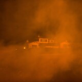 The Thomas Fire approaches a home on December 12, 2017 in Montecito, California.