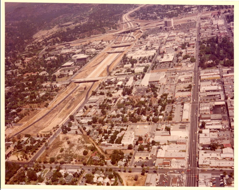 A faded historical aerial photo of the city of Pasadena in the 1970s.