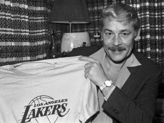 In this June 18, 1981 file photo, Jerry Buss holds a Los Angeles Lakers shirt in Los Angeles. Buss died Monday, Feb. 18, 2013. Buss, the Lakers' playboy owner who shepherded the NBA franchise to 10 championships, has died. He was 79. Bob Steiner, an assistant to Buss, confirmed Monday, Feb. 18, 2013  that Buss had died in Los Angeles. Further details were not available. 