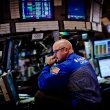 NEW YORK - SEPTEMBER 23:  Traders work on the floor of the New York Stock Exchange during morning trading on September 23, 2011 in New York City.  U.S. markets faced another volatile day amidst fears about economic growth in Europe.  (Photo by Daniel Berehulak/Getty Images)