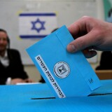 An Israeli ultra-orthodox Jewish man casts his ballot at a polling station in Bnei Brak, near the city of Tel Aviv, on March 17, 2015. Israelis are voting in a close-fought election pitting the centre left against Prime Minister Benjamin Netanyahu, who ruled out a Palestinian state in a last-ditch appeal to the far-right. AFP PHOTO / GIL COHEN-MAGEN        (Photo credit should read GIL COHEN MAGEN/AFP/Getty Images)
