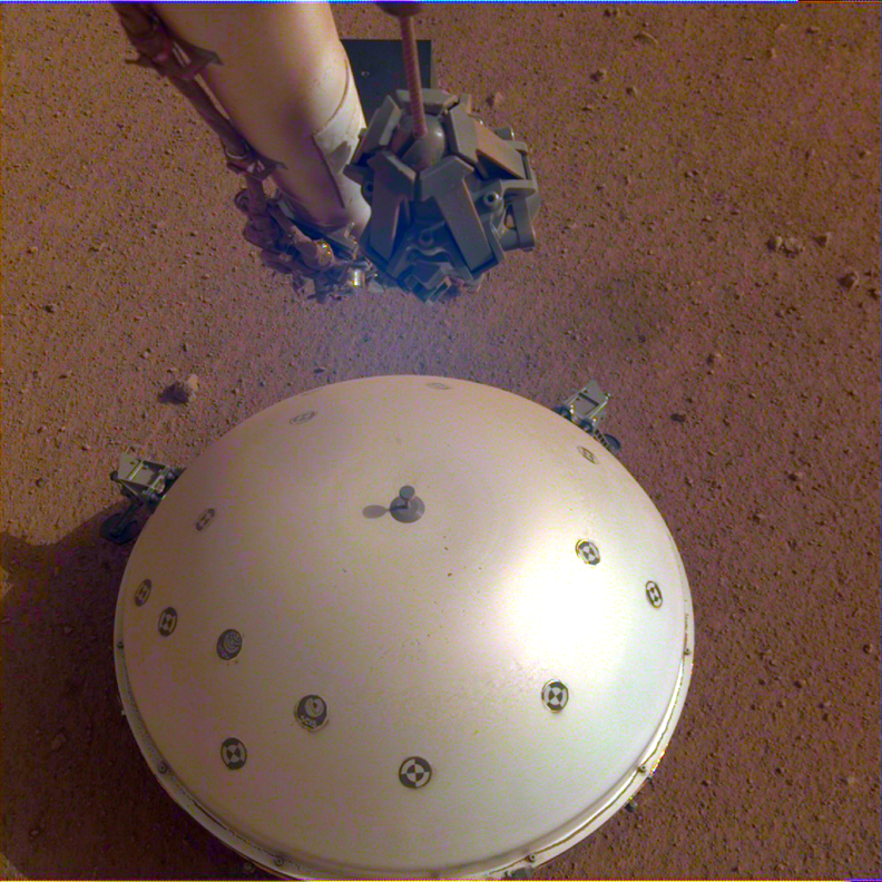 An overhead view of the dome on InSight while it's on Mars.