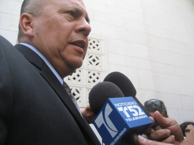 Los Angeles City Councilman Ed Reyes, who helped lead the fight for the city's economic boycott of Arizona, is surrounded by Spanish-language media outside City Hall.