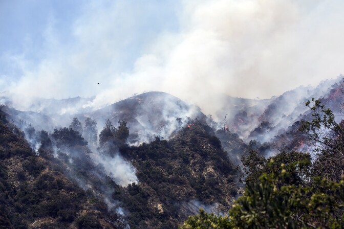 Aircraft make water drops over the San Gabriel Complex fire on Tuesday afternoon, June 21, 2016 in Bradbury near Spinks Canyon Road.